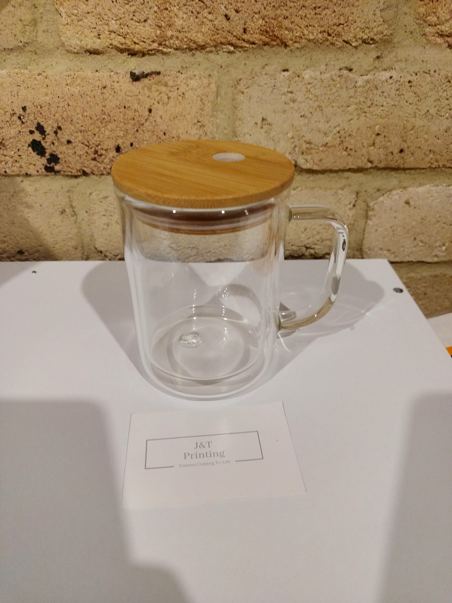 Clear glass snowglobe mug